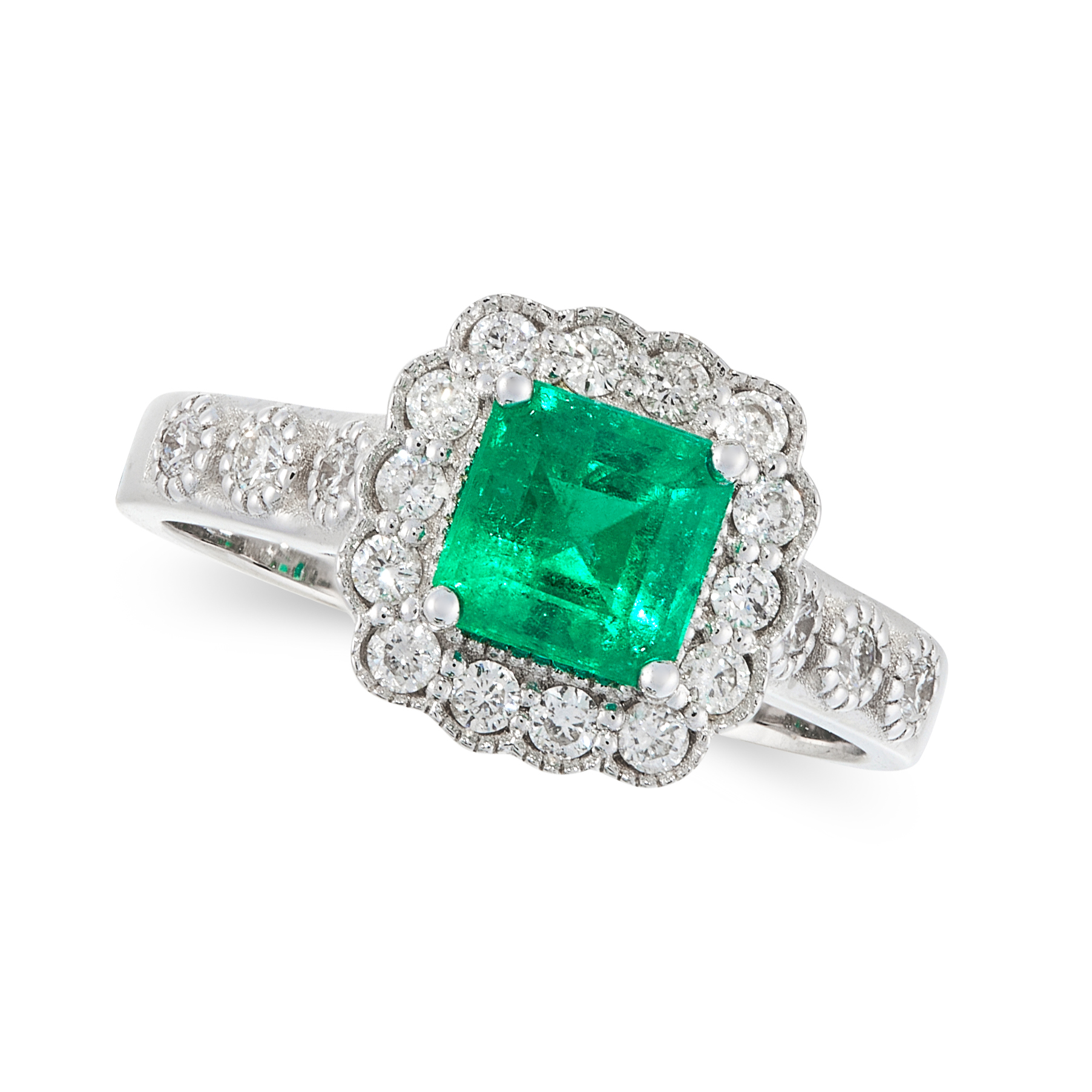 A COLOMBIAN EMERALD AND DIAMOND DRESS RING in 18ct white gold, set with an emerald cut emerald of