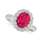 AN UNHEATED RUBY AND DIAMOND CLUSTER RING in 18ct white gold, set with an oval cut ruby of 2.17