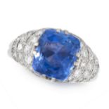 A CEYLON NO HEAT SAPPHIRE AND DIAMOND DRESS RING in 18ct white gold, set with a cushion cut blue
