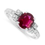 A RUBY AND DIAMOND DRESS RING in white gold, set with an oval cut ruby of 1.28 carats, accented by
