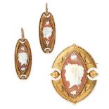 AN ANTIQUE CAMEO BROOCH AND EARRINGS SUITE in yellow gold, each set with a navette shaped carved