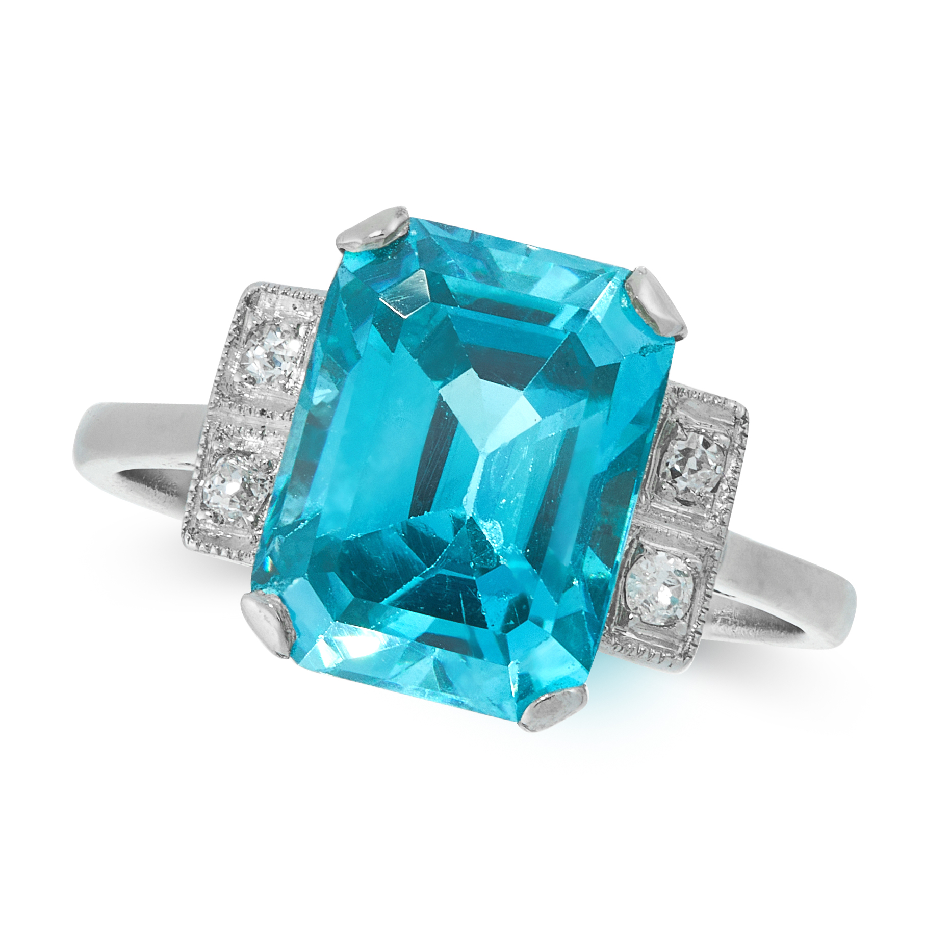 A BLUE ZIRCON AND DIAMOND DRESS RING, EARLY 20TH CENTURY in platinum, set with an emerald cut blue