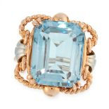 A VINTAGE AQUAMARINE DRESS RING in yellow gold and white gold, set with an emerald cut aquamarine of