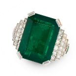 AN EMERALD AND DIAMOND RING in platinum, set with an emerald cut emerald of 10.26 carats, between