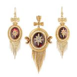 AN ANTIQUE DIAMOND, GARNET AND PEARL MOURNING LOCKET PENDANT AND EARRINGS SUITE, 19TH CENTURY in