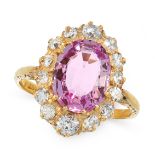 A PINK TOPAZ AND DIAMOND DRESS RING in 18ct yellow gold, set with an oval cut pink topaz of 2.75