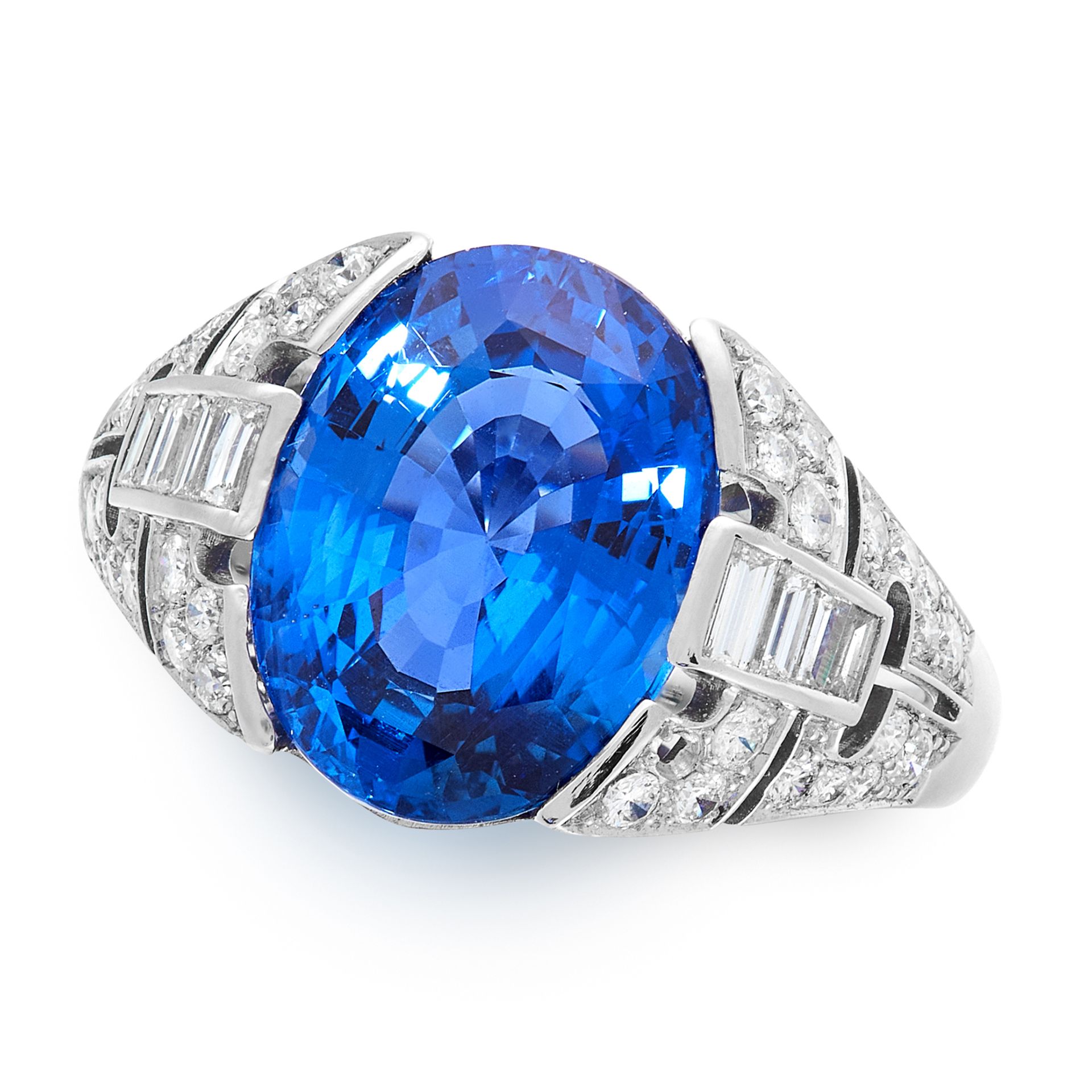 A CEYLON NO HEAT SAPPHIRE AND DIAMOND RING in platinum, set with an oval cut blue sapphire of 6.74