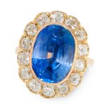 A CEYLON NO HEAT SAPPHIRE AND DIAMOND DRESS RING in 18ct yellow gold, set with a cushion cut blue