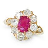 AN ANTIQUE BURMA NO HEAT RUBY AND DIAMOND DRESS RING in high carat yellow gold, set with a cushion