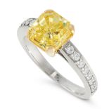 A FANCY VIVID YELLOW DIAMOND SOLITAIRE RING in 18ct yellow and white gold, set with a radiant cut