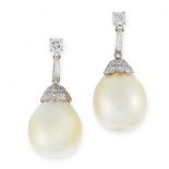 A PAIR OF PEARL AND DIAMOND EARRINGS in platinum, each set with a pearl of 14.7mm accented by