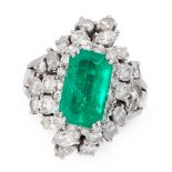 AN EMERALD AND DIAMOND DRESS RING set with an elongated emerald cut emerald of 2.86 carats within