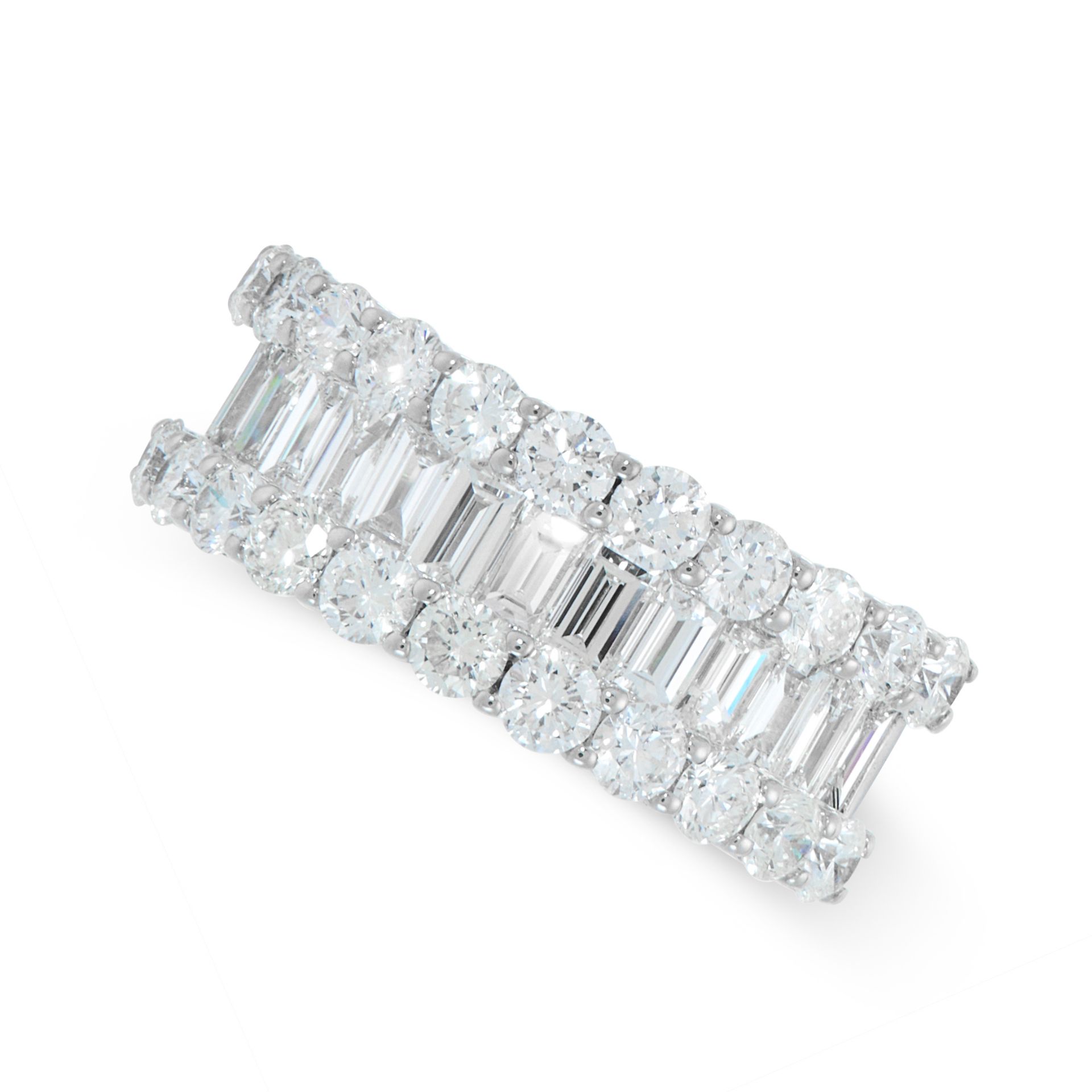 A DIAMOND ETERNITY RING in 18ct white gold, the band set half way around with a row of baguette