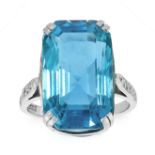 AN AQUAMARINE AND DIAMOND DRESS RING in platinum, set with a mixed emerald cut aquamarine of 18.24