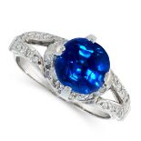 A BURMA NO HEAT SAPPHIRE AND DIAMOND DRESS RING in platinum, set with a cushion cut blue sapphire of