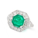 A COLOMBIAN EMERALD AND DIAMOND RING, CIRCA 1950 in 18ct white gold, set with an emerald cut emerald