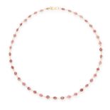 A GARNET CHAIN NECKLACE in 14ct yellow gold, set with a single row of round cut garnets, unmarked,