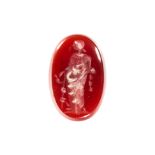 A 6.54 CARAT CARNELIAN INTAGLIO oval shaped, illustrated unmounted.