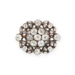 AN ANTIQUE DIAMOND BROOCH in yellow gold and silver, set to the centre with a cluster of seven old