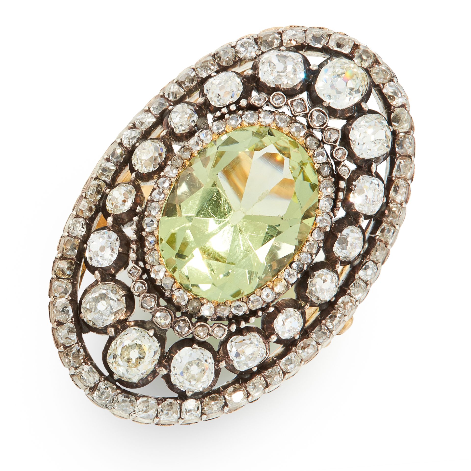 AN ANTIQUE CHRYSOBERYL AND DIAMOND COCKTAIL RING in yellow gold and silver, set with an oval cut