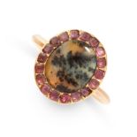 AN ANTIQUE DENDRITIC AGATE AND GARNET RING in yellow gold, set with an oval cabochon cut piece of