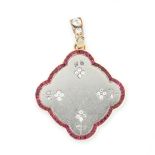 A RUBY AND DIAMOND LOCKET PENDANT, EARLY 20TH CENTURY of scalloped design, featuring flower motifs