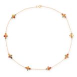 A GEMSET NECKLACE in 18ct yellow gold, in harlequin design, set with eight clusters of fancy