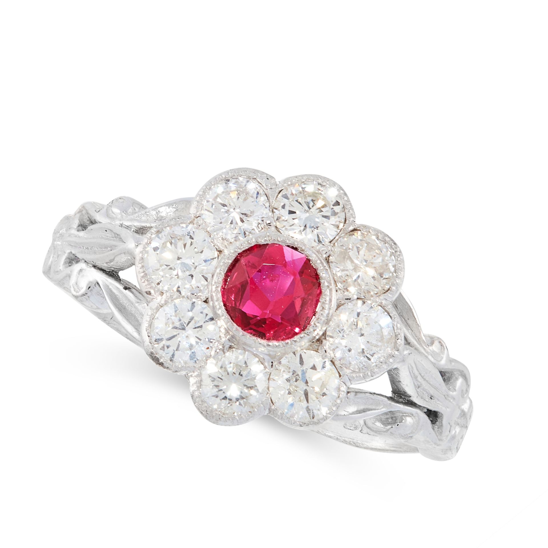 A VINTAGE RUBY AND DIAMOND CLUSTER RING in 18ct white gold, set with a round cut ruby within a