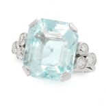 AN AQUAMARINE AND DIAMOND DRESS RING set with an emerald cut aquamarine of 15.22 carats between