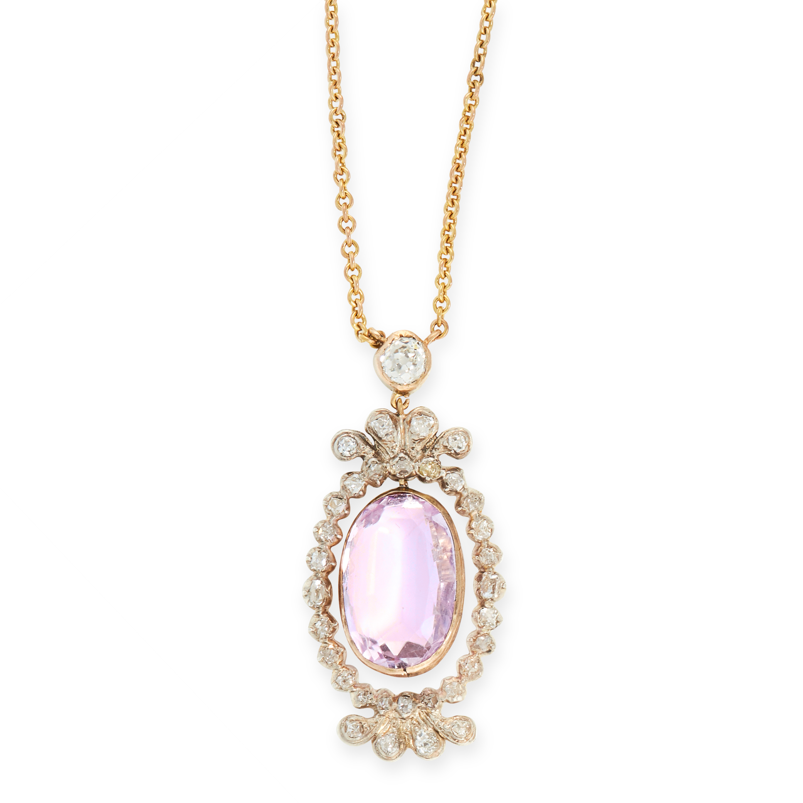 AN ANTIQUE PINK TOPAZ AND DIAMOND PENDANT NECKLACE in yellow gold and silver, set with an oval cut