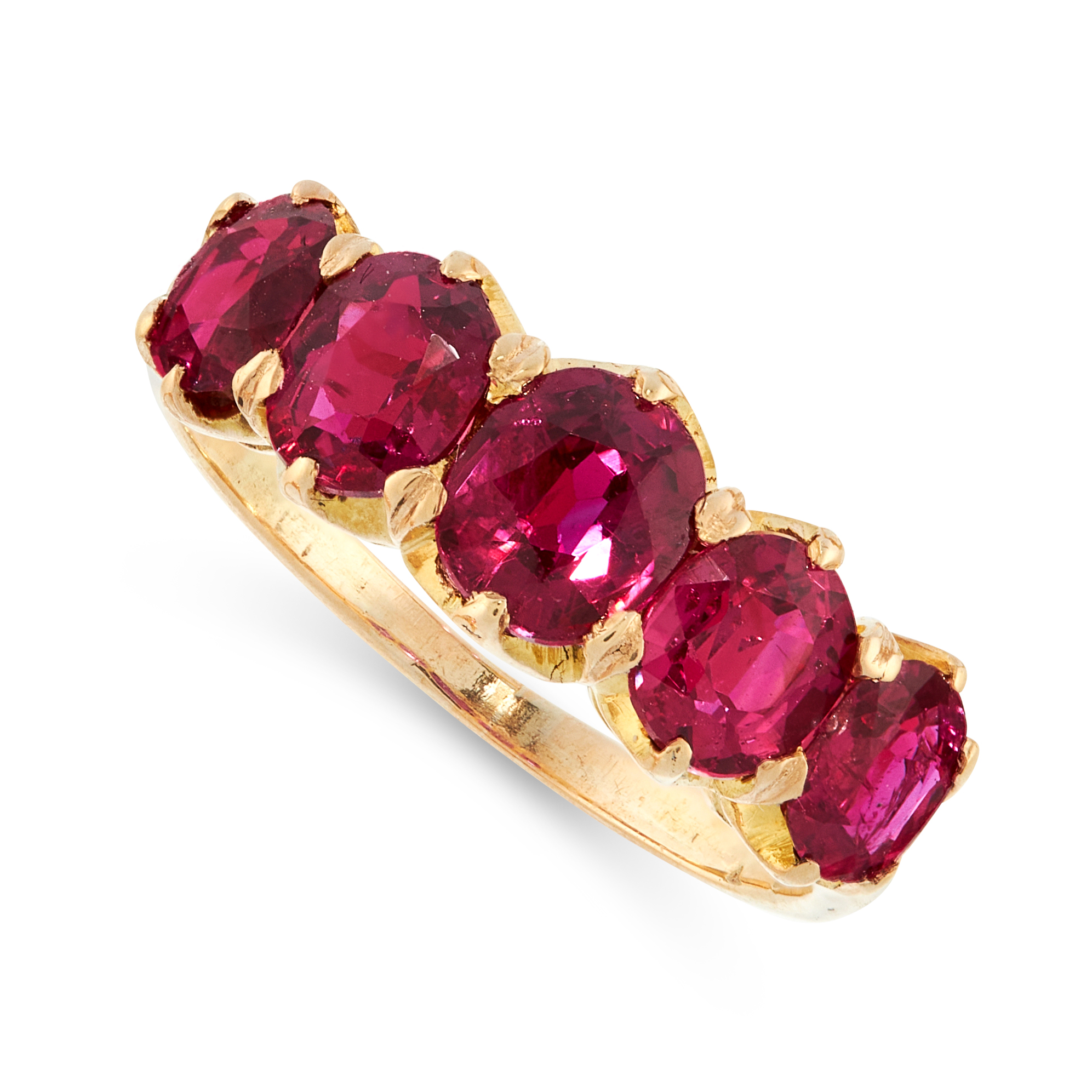 AN UNHEATED RUBY DRESS RING, CIRCA 1900 in 18ct yellow gold, set with five graduated cushion cut