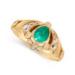 AN ANTIQUE EMERALD AND DIAMOND RING in yellow gold, set with a pear cut emerald accented by old