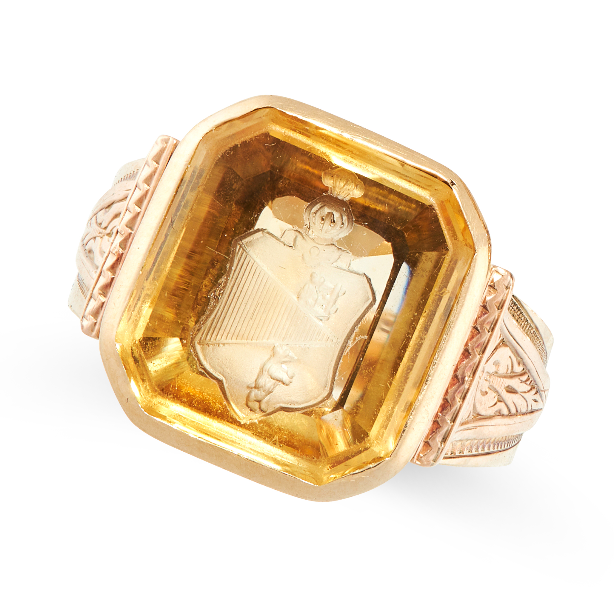 AN ANTIQUE CITRINE INTAGLIO SEAL RING in yellow gold, set with an emerald cut citrine, the face