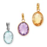 A SET OF THREE GEMSTONE PENDANTS one set with an oval cut amethyst, one set with an oval cut citrine