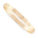 BANGLE, LOVE, CARTIER the hinged bangle engraved with screw head motifs, opening via a screw at each