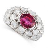 RUBY AND DIAMOND RING claw-set with an oval ruby weighing 2,40 carats, within a bombe mount set to