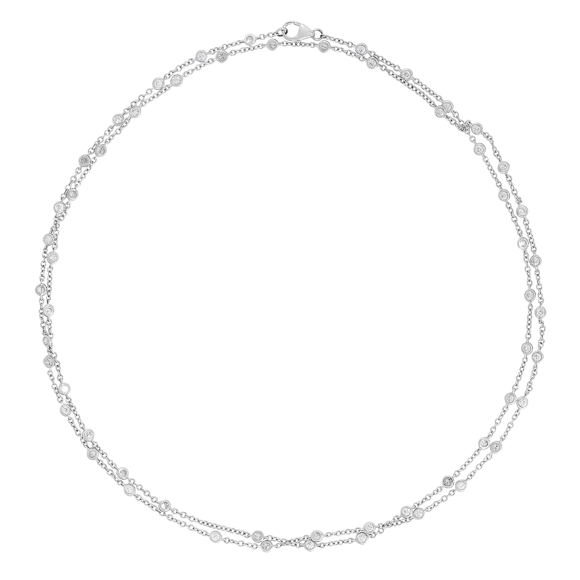 DIAMOND CHAIN SAUTOIR NECKLACE comprising a row of collet set circular cut diamonds within a fine