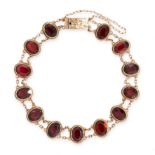 ANTIQUE GARNET BRACELET mounted in yellow gold, formed of a series of thirteen oval cut garnets in