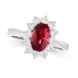 UNHEATED RUBY AND DIAMOND RING claw-set with an oval ruby weighing 2.01 carats, within a border of