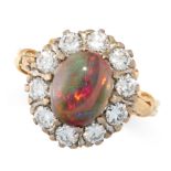 BLACK OPAL AND DIAMOND RING mounted in 18ct yellow gold, claw set to the centre with an oval