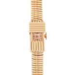 LADY'S RETRO GOLD WRISTWATCH, UNIVERSAL, 1950S in 18ct yellow gold, the fluted rectangular case with