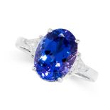 TANZANITE AND DIAMOND RING claw-set with an oval tanzanite weighing approximately 3.40 carats,