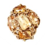 VINTAGE CITRINE RING, 1970S set with a cluster of step-cut citrines, within an abstract textured