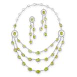 PERIDOT AND DIAMOND DEMI-PARURE comprising: a necklace of festoon design, the front suspending three