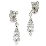 A PAIR OF DIAMOND CLIP EARRINGS in platinum and white gold, each formed of a scrolling motif,