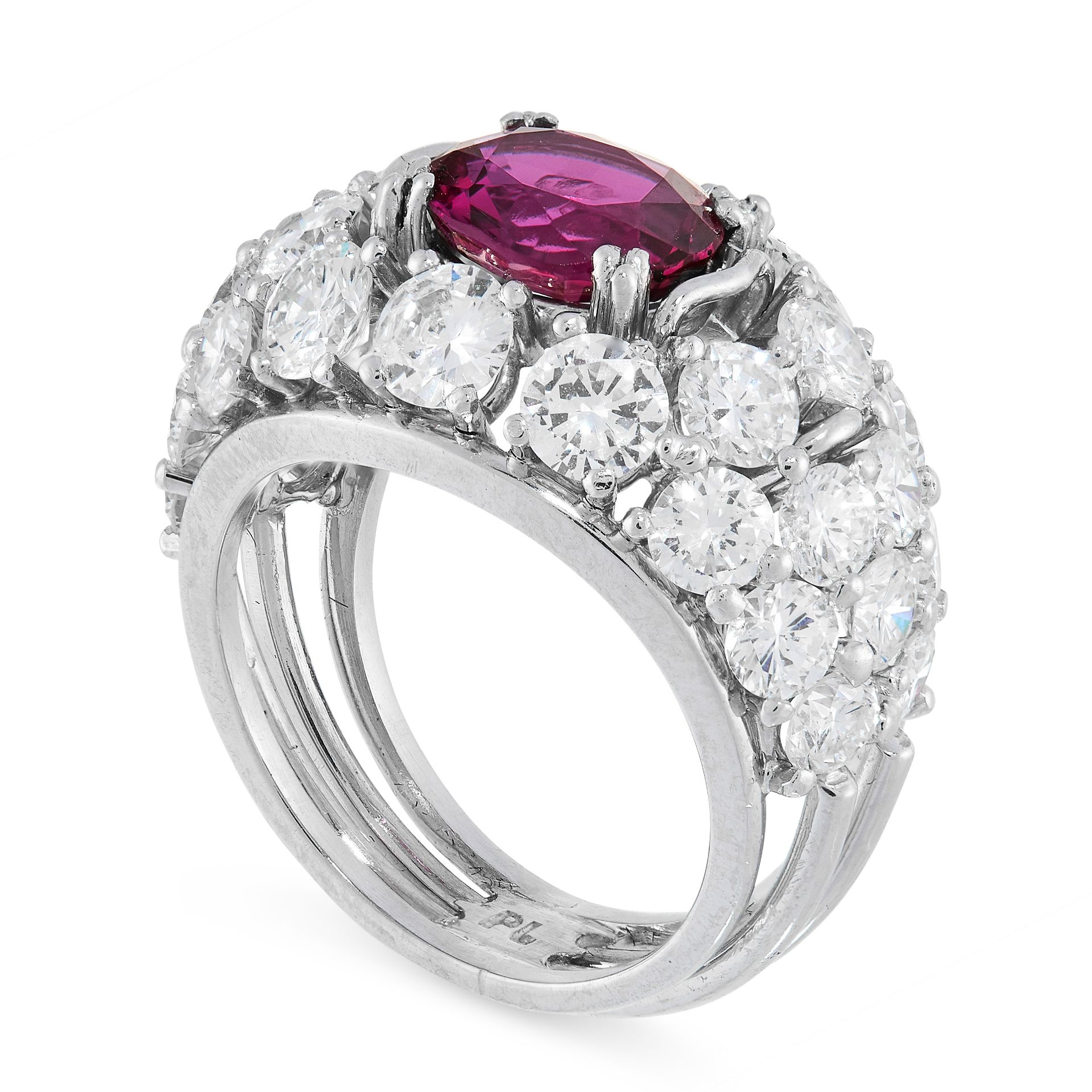 RUBY AND DIAMOND RING claw-set with an oval ruby weighing 2.40 carats, within a bombe mount set to - Image 2 of 2