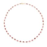 A GARNET CHAIN NECKLACE in 14ct yellow gold, set with a single row of round cut garnets, unmarked,