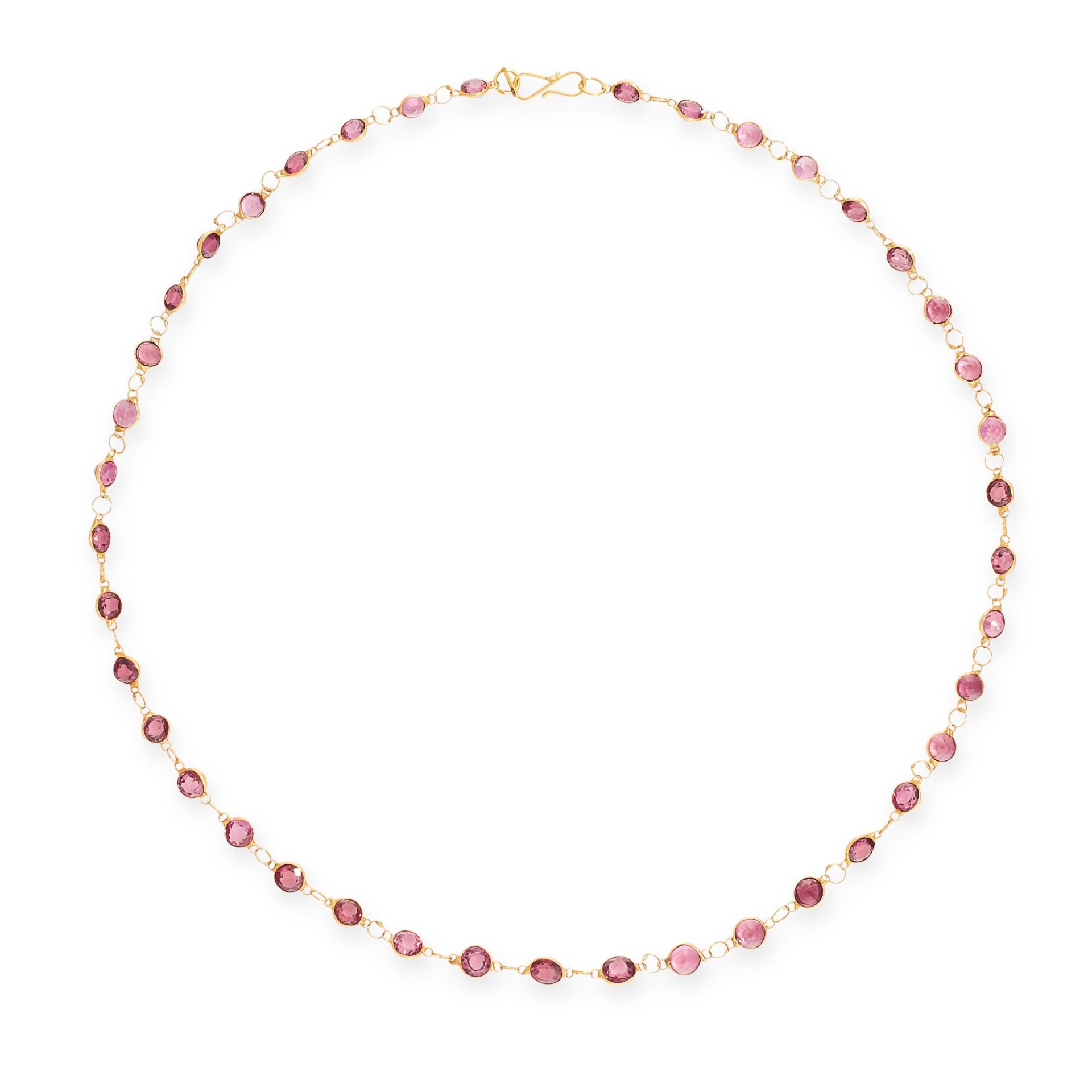 A GARNET CHAIN NECKLACE in 14ct yellow gold, set with a single row of round cut garnets, unmarked,