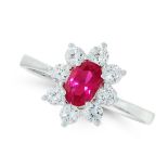 RUBY AND DIAMOND DRESS RING in 18ct white gold, set with an oval cut ruby of 0.60 carats within a