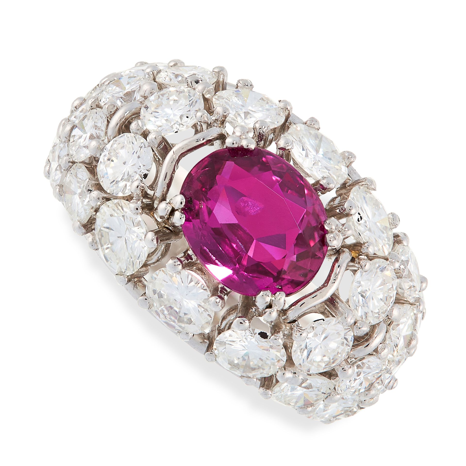 RUBY AND DIAMOND RING claw-set with an oval ruby weighing 2.40 carats, within a bombe mount set to